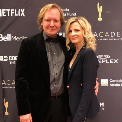 Jackie Torrens's brother Jonathan Torrens and his wife, Carole Torrens attends the 2018 Cdn Screen Awards in matching formal attires.